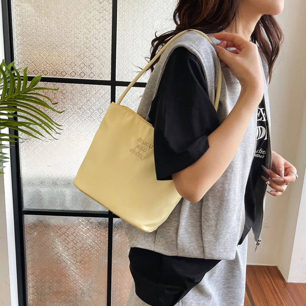 Summer new simple nylon underarm bag Korean niche design alphabet embroidery portable commuter bucket bag