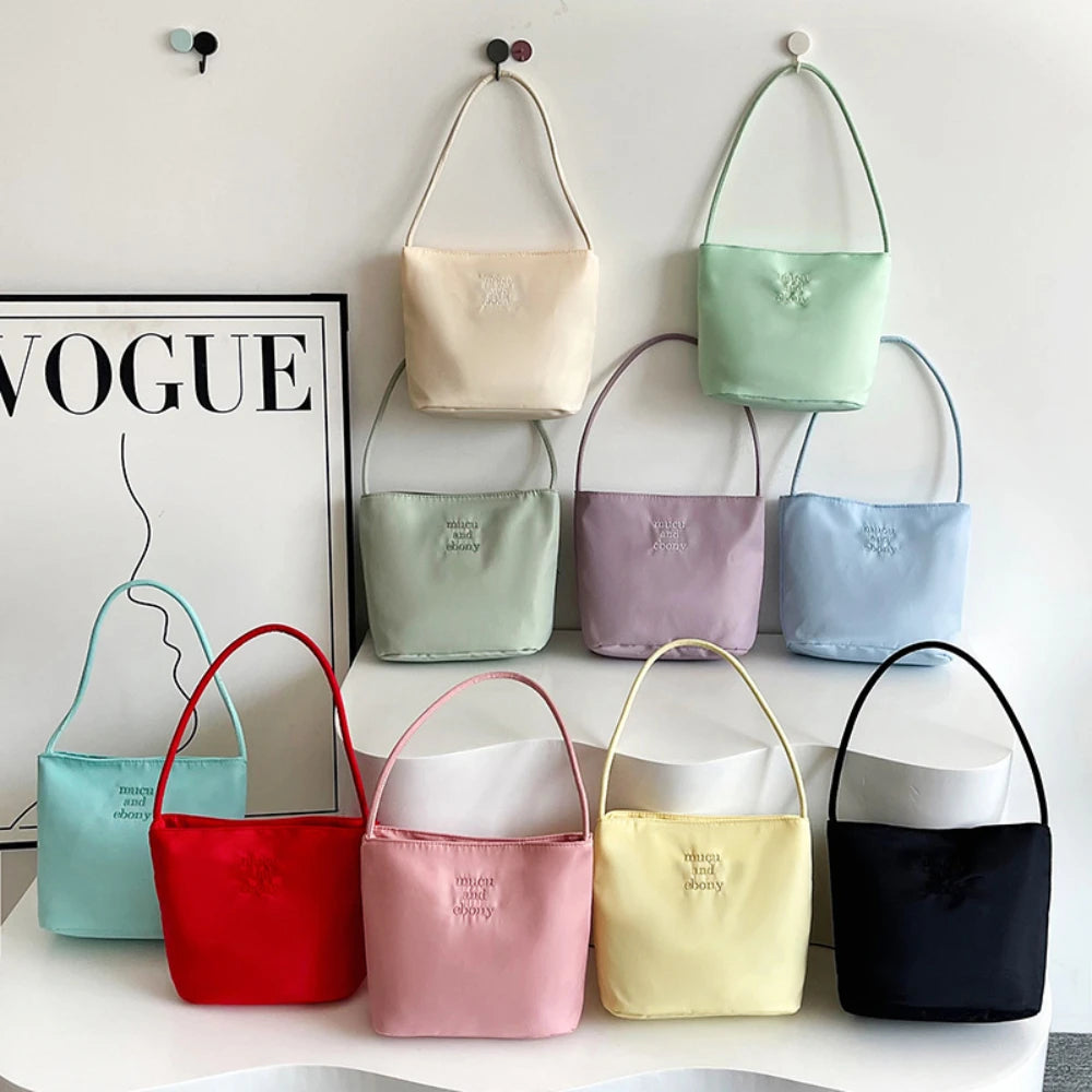 Summer new simple nylon underarm bag Korean niche design alphabet embroidery portable commuter bucket bag