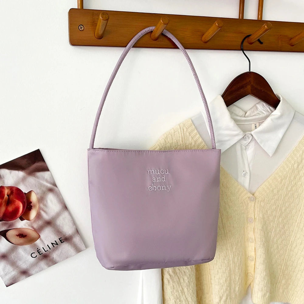 Summer new simple nylon underarm bag Korean niche design alphabet embroidery portable commuter bucket bag