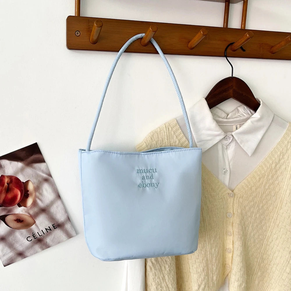 Summer new simple nylon underarm bag Korean niche design alphabet embroidery portable commuter bucket bag