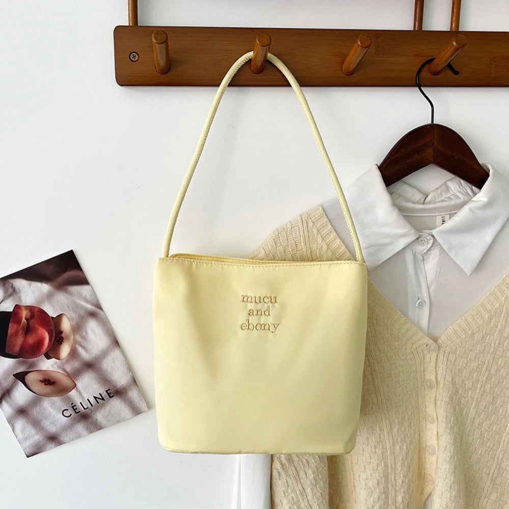 Summer new simple nylon underarm bag Korean niche design alphabet embroidery portable commuter bucket bag