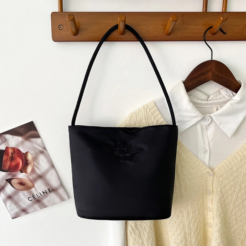 Summer new simple nylon underarm bag Korean niche design alphabet embroidery portable commuter bucket bag